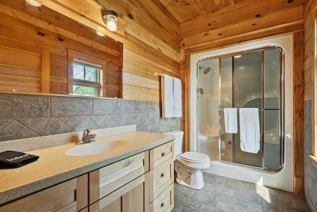 2799 27th St Unit 9 Douglas 1, Birchwood, WI 54817 - full bathroom with a shower stall, toilet, wood walls, vanity, and decorative backsplash