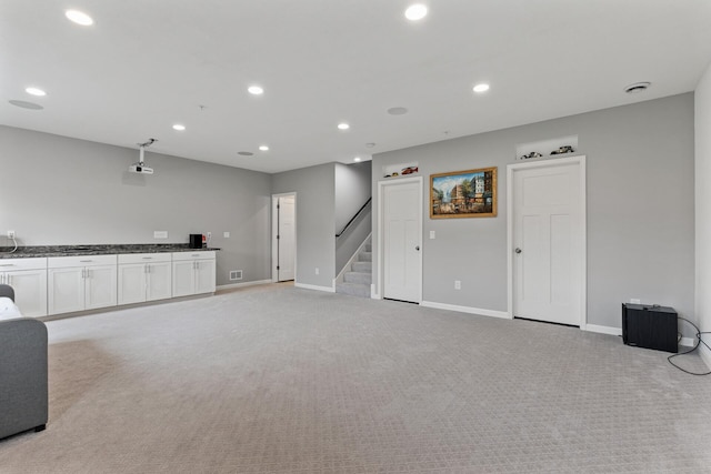 unfurnished living room with light carpet