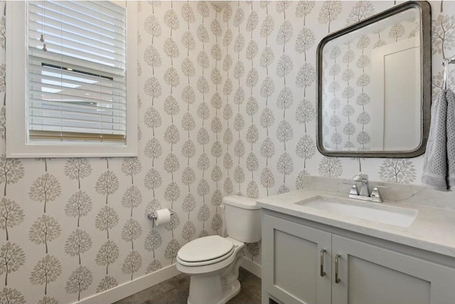 bathroom featuring vanity and toilet