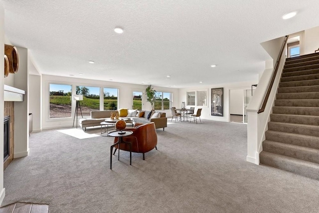 living room with light colored carpet and a textured ceiling