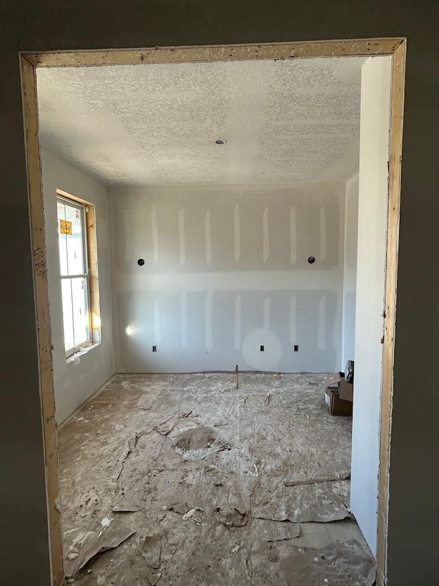 empty room with a textured ceiling