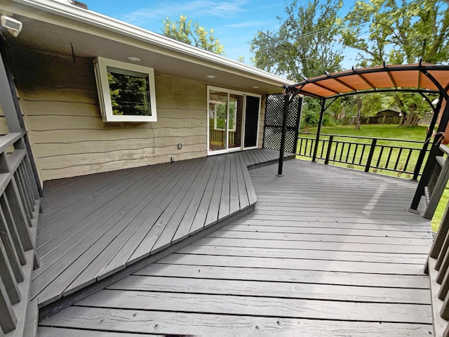 deck featuring a lawn