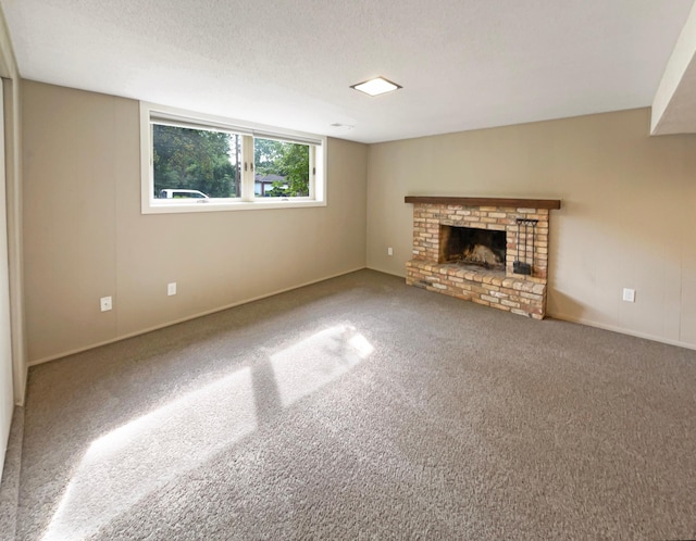 unfurnished living room featuring carpet floors, a fireplace, and a textured ceiling