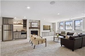 carpeted living room with a fireplace