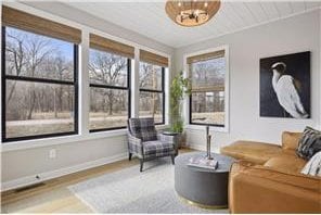 interior space featuring a notable chandelier and hardwood / wood-style flooring