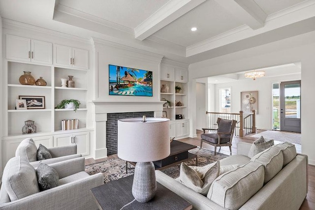 living room featuring beamed ceiling, a chandelier, and hardwood / wood-style flooring