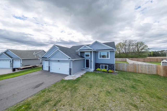 view of front of home featuring a garage and a front lawn