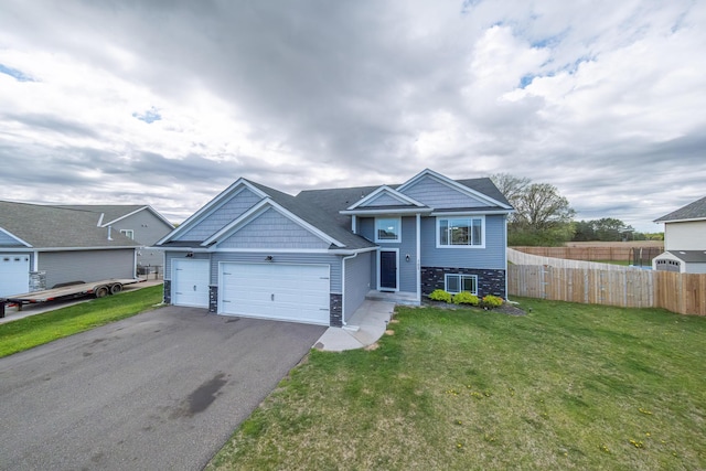 view of front of property with a front yard and a garage