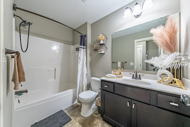 full bathroom featuring a textured ceiling, shower / tub combo with curtain, vanity, and toilet