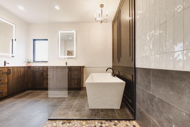 bathroom with vanity, tile patterned floors, and a notable chandelier