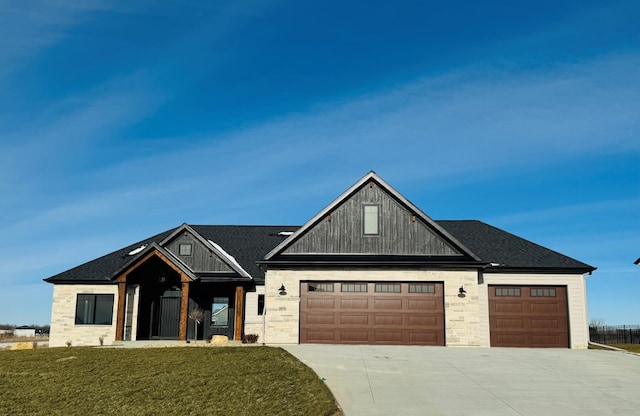 view of front facade with a garage and a front lawn