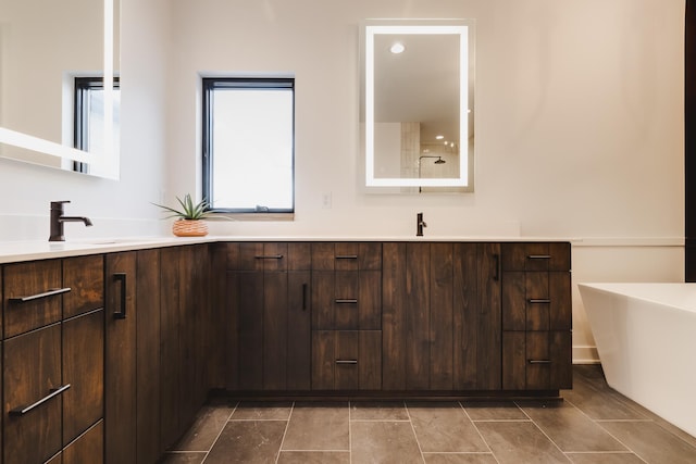 bathroom featuring a bathing tub and vanity