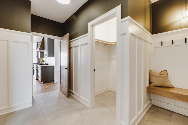 mudroom with light tile patterned floors