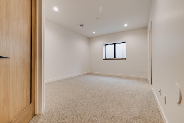 empty room featuring light colored carpet