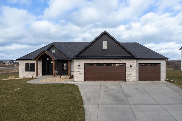 view of front facade with a front yard and a garage