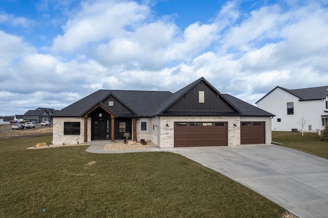 view of front of house with a front yard and a garage