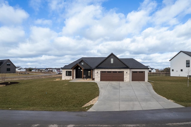 view of front facade with a garage and a front lawn