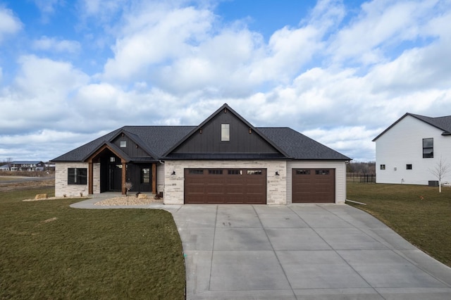 view of front of home with a garage and a front lawn