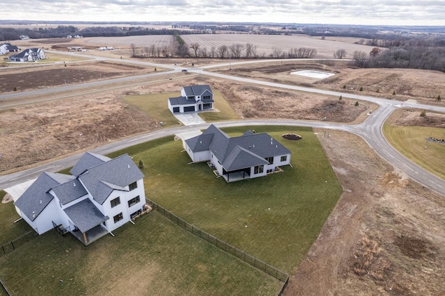 birds eye view of property with a rural view