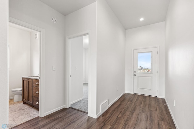 corridor featuring dark hardwood / wood-style flooring