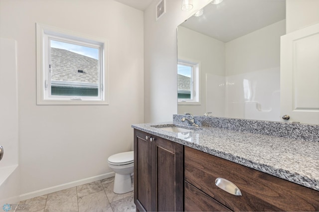 bathroom with vanity and toilet