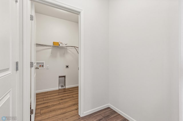 washroom with washer hookup, hookup for an electric dryer, and wood-type flooring