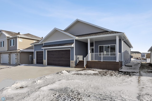 view of front of property featuring a garage and a porch