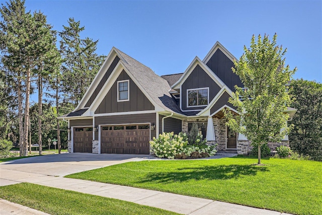 craftsman inspired home featuring board and batten siding, stone siding, concrete driveway, and a garage