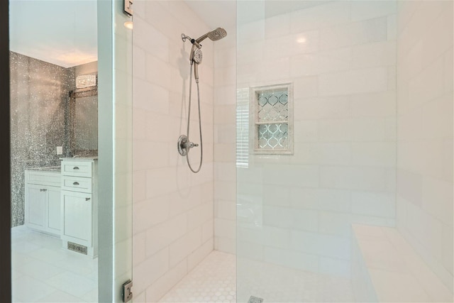 full bath with tiled shower