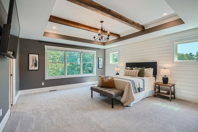 bedroom featuring light carpet, multiple windows, and beam ceiling