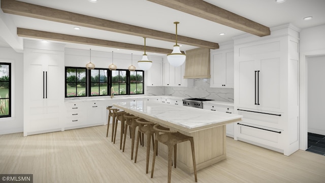 kitchen with white cabinetry, custom exhaust hood, hanging light fixtures, decorative backsplash, and a kitchen island