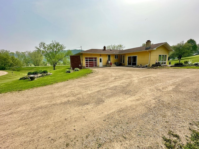 ranch-style home featuring a front yard and central AC unit