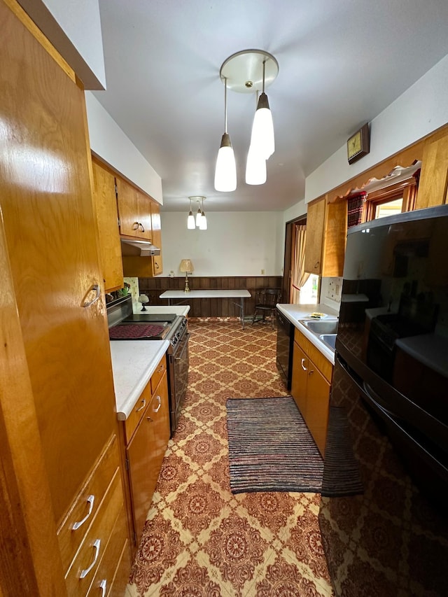 kitchen with custom exhaust hood, electric stove, carpet flooring, black fridge, and hanging light fixtures