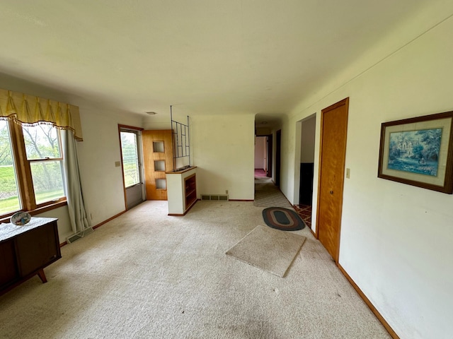 unfurnished living room with carpet flooring