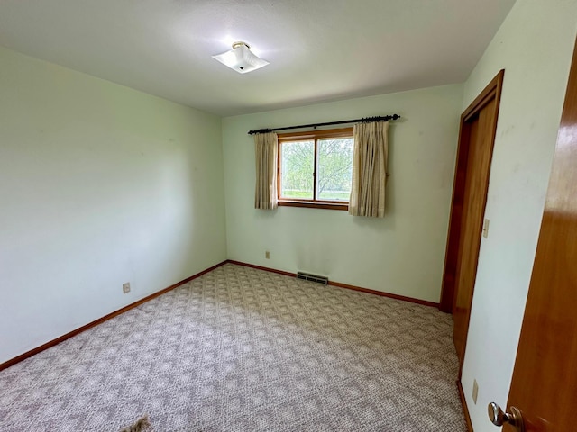 empty room featuring carpet floors