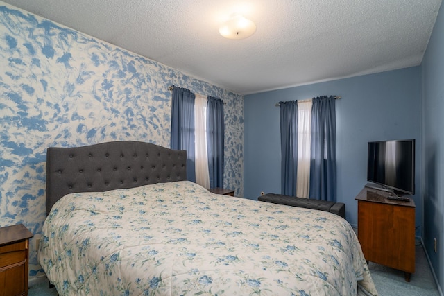 carpeted bedroom featuring a textured ceiling