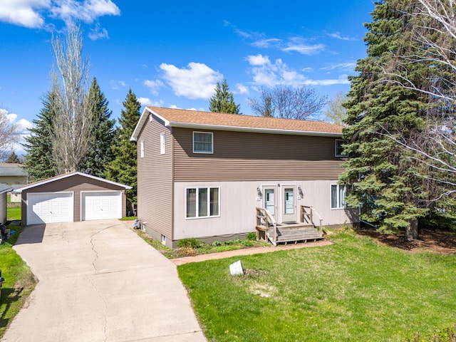 view of front property with an outbuilding, a front yard, and a garage