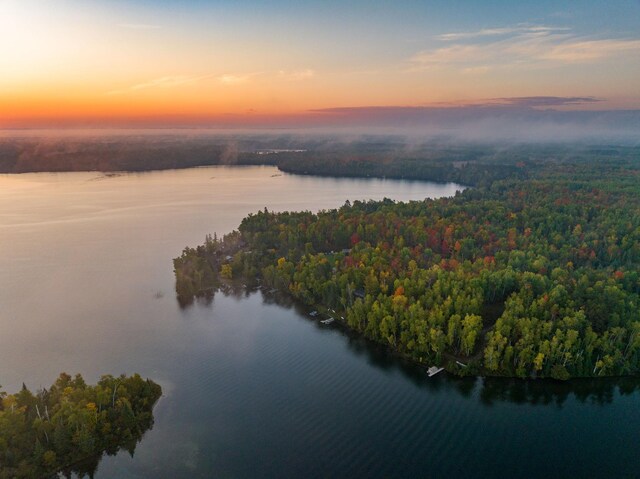 aerial view at dusk with a water view