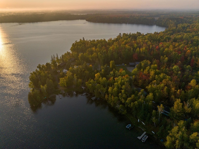 aerial view at dusk with a water view