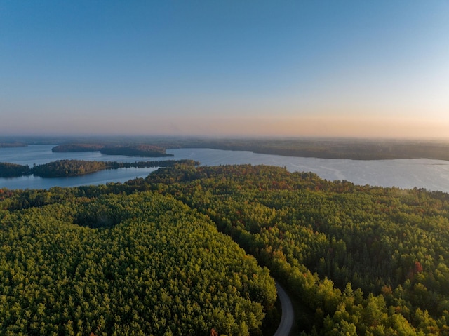 aerial view at dusk with a water view