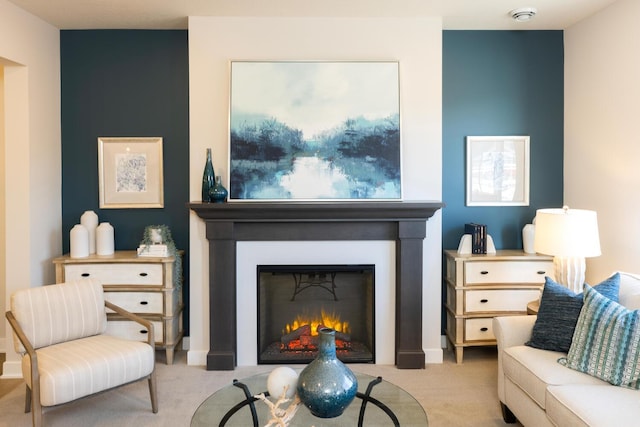 sitting room featuring light colored carpet