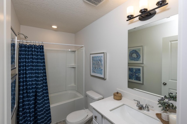 full bathroom featuring vanity, shower / bath combination with curtain, a textured ceiling, and toilet