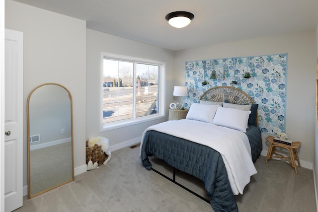 bedroom featuring light carpet