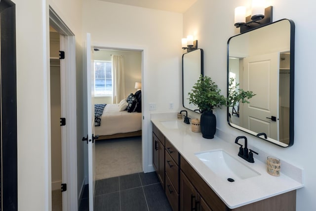 bathroom featuring tile flooring, large vanity, and double sink