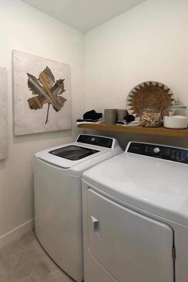 laundry room with independent washer and dryer