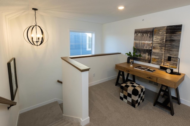 carpeted office space featuring a chandelier