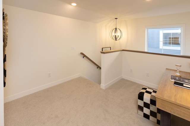 unfurnished office featuring a chandelier and carpet floors