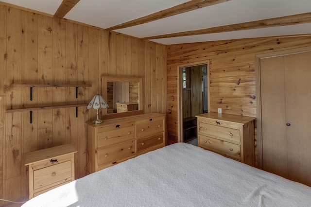 bedroom featuring vaulted ceiling with beams and wood walls