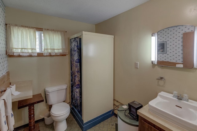 bathroom with tile patterned flooring, toilet, and sink