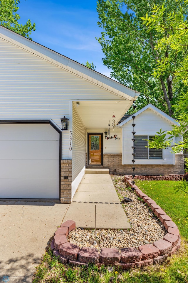 doorway to property featuring a garage